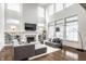 Spacious living room featuring a cozy fireplace, built-in shelving, and comfortable seating arrangements at 15679 Woodford Dr, Westfield, IN 46074