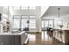 Bright and open living room with modern furnishings, hardwood floors, and large windows for natural light at 15679 Woodford Dr, Westfield, IN 46074