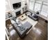 Overhead view of a stylish living room with a fireplace, built-ins, plush seating, and hardwood floors at 15679 Woodford Dr, Westfield, IN 46074