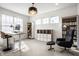 Modern home office with a standing desk, ample storage, and a comfortable chair at 15679 Woodford Dr, Westfield, IN 46074
