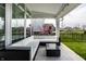 Inviting covered patio with comfortable seating and stylish decor, perfect for outdoor relaxation and entertaining at 15679 Woodford Dr, Westfield, IN 46074