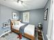 Cozy bedroom with a comfortable bed, featuring a white comforter and stylish decor at 1627 E 8Th St, Anderson, IN 46012