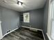 Simple bedroom with modern flooring, natural light, and fresh paint, a blank canvas for your dreams at 1627 E 8Th St, Anderson, IN 46012
