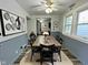 Charming dining room with a ceiling fan, complete with a dark wood table and modern decor at 1627 E 8Th St, Anderson, IN 46012