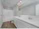 Modern bathroom featuring a double vanity and tub with shower at 16441 Mount Logan Rd, Noblesville, IN 46060