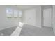 Bedroom with plush carpets, ample light, and a closet and entrance to another room at 16441 Mount Logan Rd, Noblesville, IN 46060