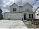Charming new two-story home featuring a three-car garage and classic black shutters against a bright white facade at 16441 Mount Logan Rd, Noblesville, IN 46060