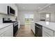Contemporary kitchen features gas range, subway tile backsplash, and stainless steel appliances at 16441 Mount Logan Rd, Noblesville, IN 46060