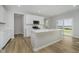 Well-equipped kitchen showcases an island with bar seating and sliding glass doors to outside at 16441 Mount Logan Rd, Noblesville, IN 46060