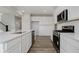 Open-concept kitchen boasts stainless steel appliances and ample countertop space at 16441 Mount Logan Rd, Noblesville, IN 46060