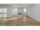 Open living room features recessed lights, wood floors, and fireplace at 16441 Mount Logan Rd, Noblesville, IN 46060