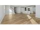 Open-concept living area with staircase and large kitchen island at 16441 Mount Logan Rd, Noblesville, IN 46060
