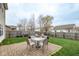 Cozy backyard with a brick-paved patio, a seating area, and a well-maintained lawn at 16963 Southall Dr, Westfield, IN 46074