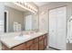 Bright bathroom featuring double sinks, neutral colors, and modern fixtures at 16963 Southall Dr, Westfield, IN 46074