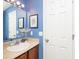 Cozy bathroom featuring blue walls and a wood vanity at 16963 Southall Dr, Westfield, IN 46074