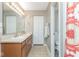Bright bathroom featuring double sinks, neutral colors, and a separate toilet area at 16963 Southall Dr, Westfield, IN 46074
