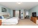 Well-lit main bedroom with plush carpet, a large window, and comfortable furnishings at 16963 Southall Dr, Westfield, IN 46074