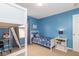 Bright bedroom featuring a bed with playful designs, a desk, and ample floor space at 16963 Southall Dr, Westfield, IN 46074