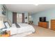 Well-lit main bedroom with plush carpet, a large window, and cozy furnishings at 16963 Southall Dr, Westfield, IN 46074