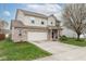 Two-story home with brick and siding, two-car garage, and a well-maintained lawn on a sunny day at 16963 Southall Dr, Westfield, IN 46074