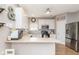 Bright kitchen featuring stainless steel appliances, white cabinets, and light countertops at 16963 Southall Dr, Westfield, IN 46074