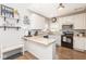 Bright kitchen with stainless steel appliances, hardwood floors, and white cabinets at 16963 Southall Dr, Westfield, IN 46074