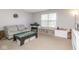 Bright living room with neutral walls, plush carpet, comfortable seating, and play area at 16963 Southall Dr, Westfield, IN 46074