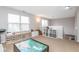 Bright living area with play structures and plank flooring at 16963 Southall Dr, Westfield, IN 46074