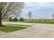 Pleasant street view with green lawns, trees, and a glimpse of the neighborhood at 16963 Southall Dr, Westfield, IN 46074