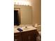 Bathroom vanity with mirror, wood cabinets, sink, faucet, and toilet at 1915 Barbie Ct, Franklin, IN 46131