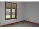 Bedroom with gray carpet, window with blinds, and neutral colored walls and trim at 1915 Barbie Ct, Franklin, IN 46131