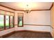 Elegant dining room with hardwood floors, decorative molding, and large windows for natural light at 1915 Barbie Ct, Franklin, IN 46131