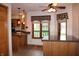 Eat-in kitchen featuring a breakfast bar, granite counters, and modern lighting at 1915 Barbie Ct, Franklin, IN 46131