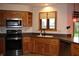 An updated kitchen with stainless steel appliances and granite countertops at 1915 Barbie Ct, Franklin, IN 46131