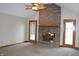 Spacious living room with a brick fireplace, ceiling fan, and neutral carpet for a cozy atmosphere at 1915 Barbie Ct, Franklin, IN 46131