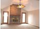 Bright and airy living room featuring a cozy fireplace, ceiling fan, and plush carpeting at 1915 Barbie Ct, Franklin, IN 46131