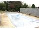 Backyard swimming pool area with a safety cover in place and concrete surround at 1915 Barbie Ct, Franklin, IN 46131