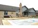 Backyard swimming pool area with a safety cover in place and concrete surround at 1915 Barbie Ct, Franklin, IN 46131