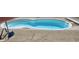 Swimming pool with a white edge and steps, surrounded by concrete at 1915 Barbie Ct, Franklin, IN 46131
