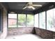 Screened porch with ceiling fan, brick base, and view of backyard at 1915 Barbie Ct, Franklin, IN 46131