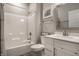Neutral bathroom with modern vanity, framed mirror, and a shower-tub combination at 19668 Mcdonald Pl, Westfield, IN 46074
