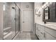 Stylish bathroom featuring a glass-enclosed shower and a dual sink vanity with modern fixtures at 19668 Mcdonald Pl, Westfield, IN 46074