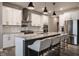Modern kitchen with stainless steel appliances, granite countertops, and ample seating at 19668 Mcdonald Pl, Westfield, IN 46074