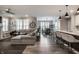 Open-concept living area featuring hardwood floors and ample natural light at 19668 Mcdonald Pl, Westfield, IN 46074