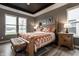 Stunning main bedroom with tray ceiling, elegant furnishings, and lots of natural light at 19668 Mcdonald Pl, Westfield, IN 46074