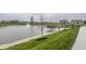 Picturesque community pond with fountain, pier, and attractive landscaping at 19668 Mcdonald Pl, Westfield, IN 46074