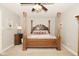Elegant bedroom with a four-poster bed, carpeted floors, and decorative columns at 2004 Caledonian Ct, Greenwood, IN 46143