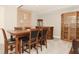 Dining room featuring a large wooden table, chairs, and built-in display cabinets at 2004 Caledonian Ct, Greenwood, IN 46143
