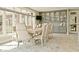 Bright dining area featuring built-in display cabinets and a large window for ample natural light at 2004 Caledonian Ct, Greenwood, IN 46143