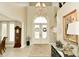A luxurious foyer featuring a grand entry, elegant chandelier, and beautiful architectural details at 2004 Caledonian Ct, Greenwood, IN 46143